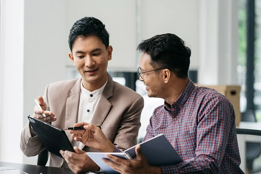 Two people discussing information together