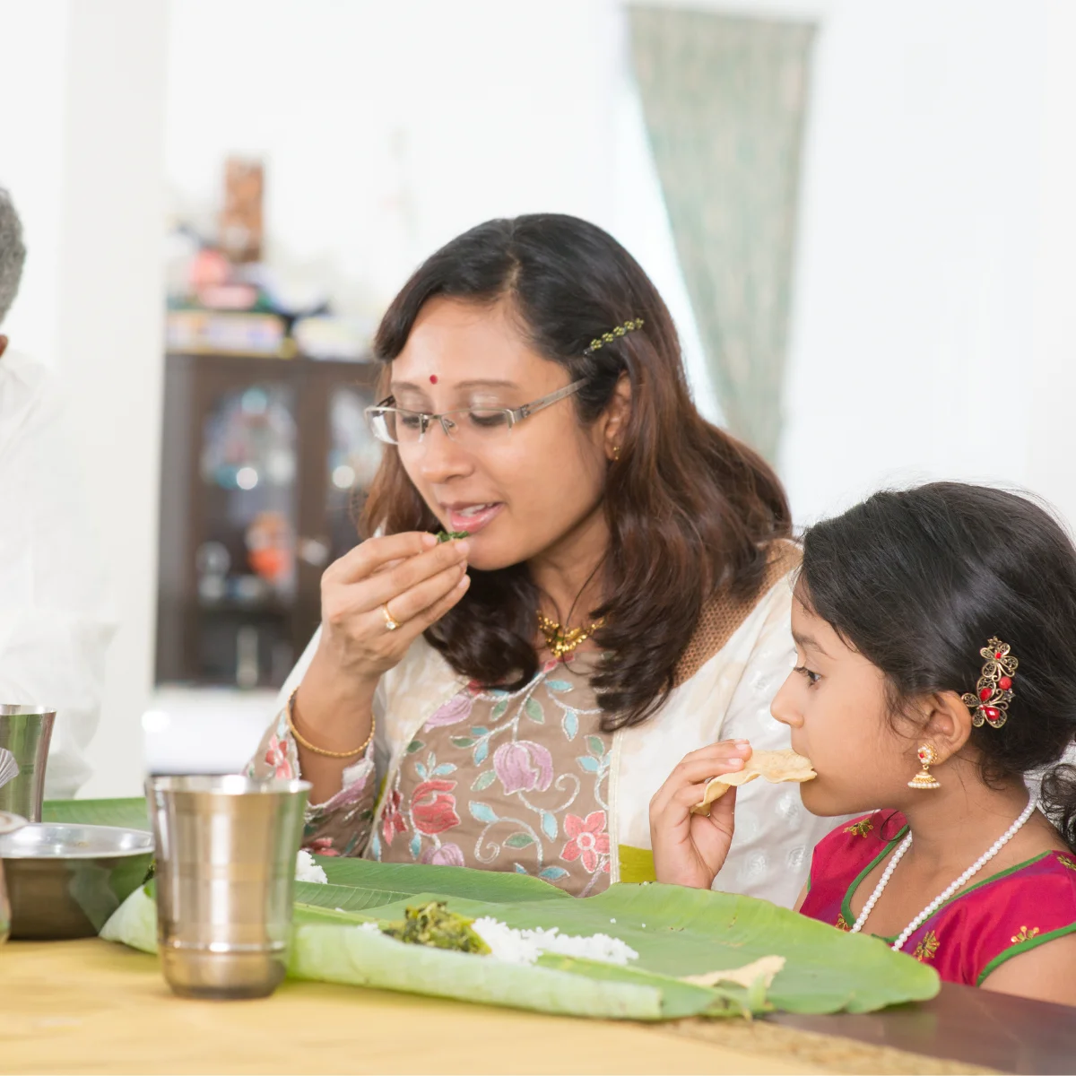 A family having dinner together speaking Tamil