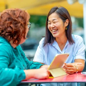 Two women speaking Italian