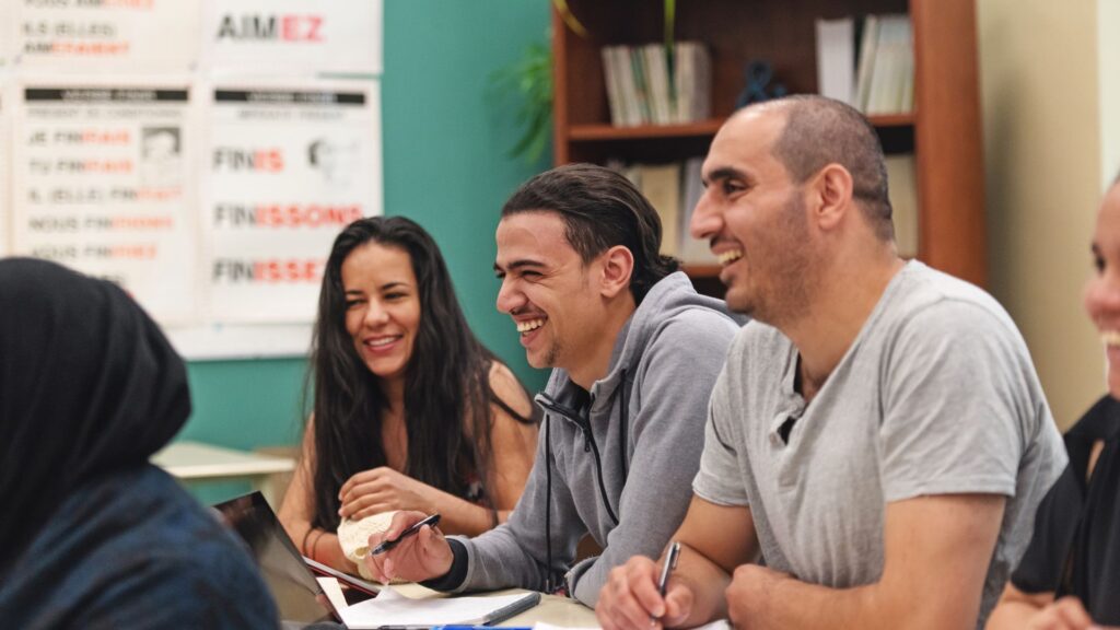 adult learners in live language class with native speaker teacher